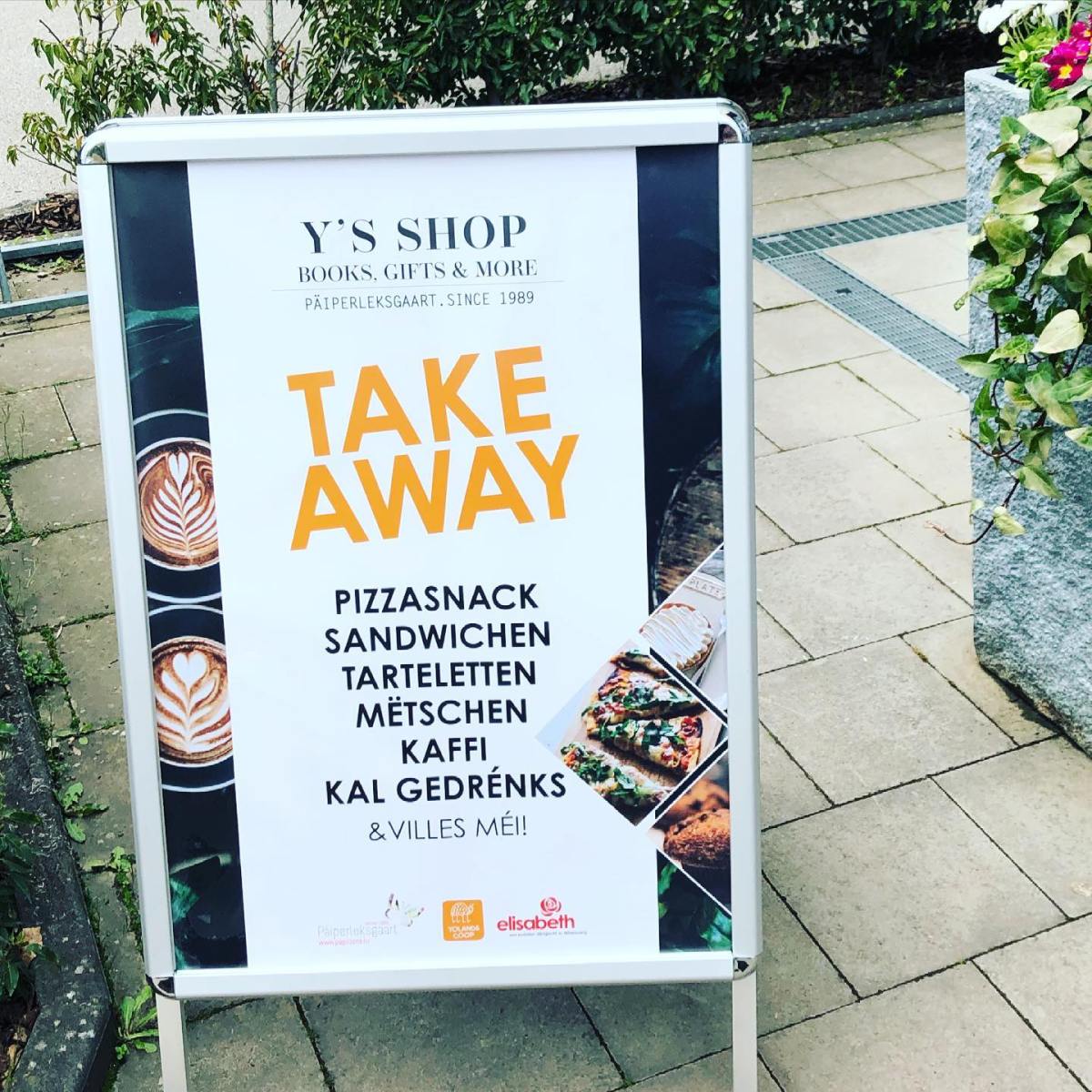 a sign on a sidewalk