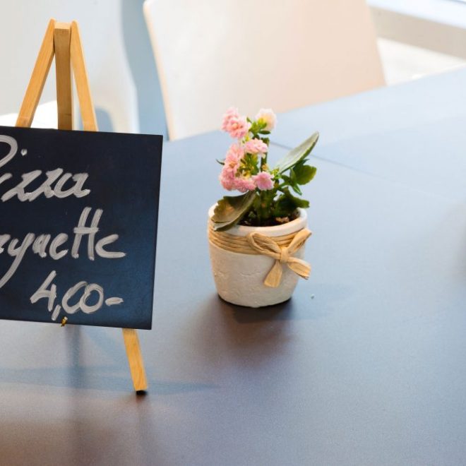 a vase of flowers sitting on a table